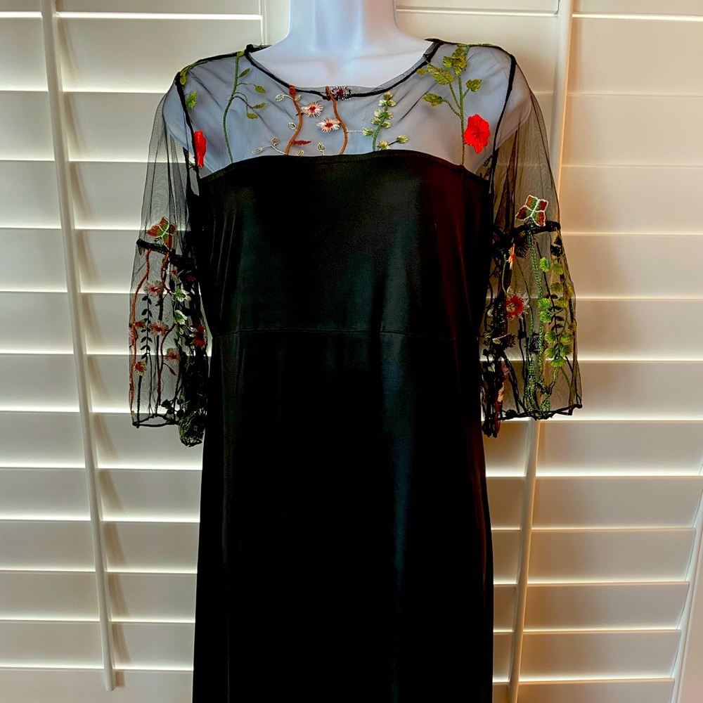 Black embroideried dress.